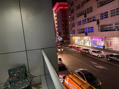 a view of a city street with cars on the road at Short Stay Partition Room in Al Barsha 1 Near Mashreq Metro in Dubai