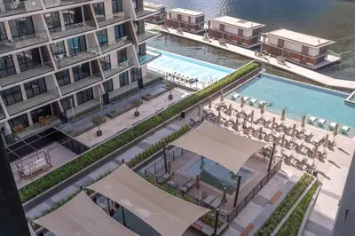 an overhead view of a swimming pool in a building at Ranch Living 1 bedroom apartment in Business Bay by Suiteable in Dubai