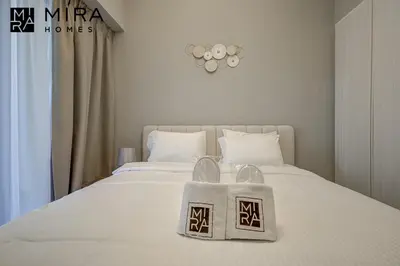 a bedroom with a bed with a basket on it at Mira Holiday Homes - Serviced apartment in Zada Tower in Dubai