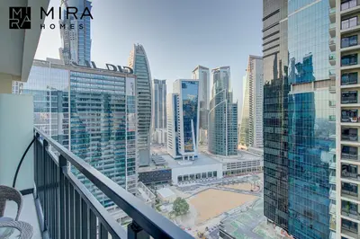 a view of a city from the balcony of a building at Mira Holiday Homes - Serviced apartment in Zada Tower in Dubai