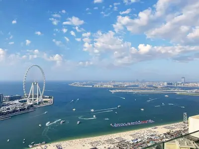 an aerial view of a beach and a ferris wheel at FAM Living- Luxe Penthouse in JBR Marina - Panaromic Sea View in Dubai