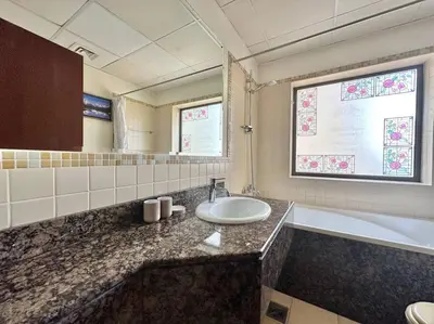 a bathroom with a sink and a bath tub at Sun, Sand, and FUN - King Bed, Sofa Bed! Sleeps 4 in Dubai