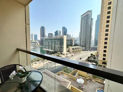 a view of a city from a balcony of a building at Sun, Sand, and FUN - King Bed, Sofa Bed! Sleeps 4 in Dubai