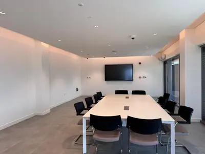 a conference room with a large table and chairs at Spacious 1 bed in La Mer - 1 min to the beach in Dubai