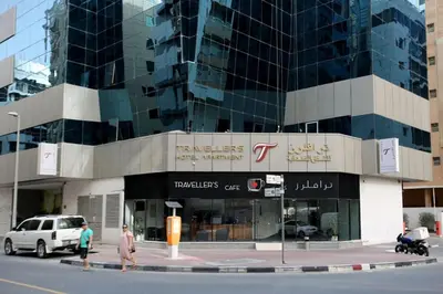 a building with people walking in front of it at Brand New Private Partition Near MOE Metro in Dubai