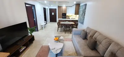 a living room with a couch and a table at Preatoni Tower - JLT by Golden Casa in Dubai