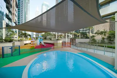 a swimming pool on the roof of a building at Luton Vacation Homes - Tranquil 2BR Haven in the Heart of Dubai Marina- 28AB04 in Dubai