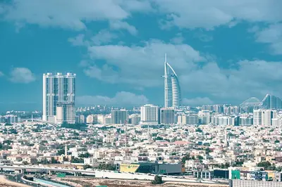 a view of a city with a tall skyscraper at Cozy Studio 29th Floor, Bloom Towers Marina View in Dubai