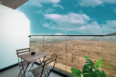 a balcony with a table and a view of a field at Cozy Studio 29th Floor, Bloom Towers Marina View in Dubai