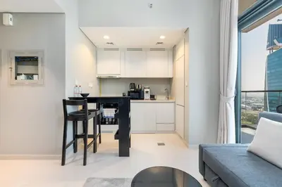 a kitchen and living room with a bar in a apartment at 1 Bedroom in Zada Tower - Business Bay - Dubai in Dubai