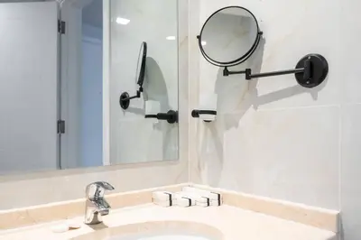 a bathroom with a sink and a mirror at Studio with Burj Khalifa View in Dubai