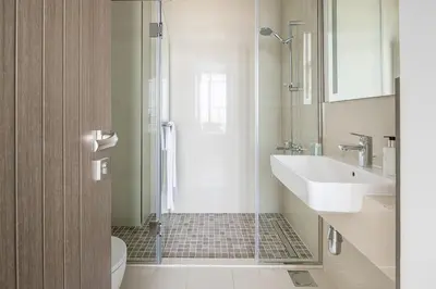 a bathroom with a shower and a sink and a toilet at Frank Porter - Bluebell Residence in Dubai