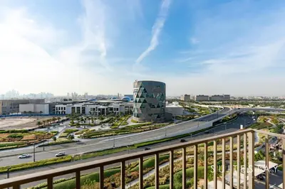 an aerial view of a city with a highway at Chic Bright One Bedroom Suite in Dubai