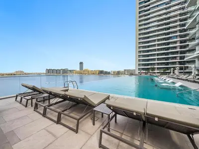 a swimming pool on the roof of a building at StoneTree - Luxurious with Private Beach Access in Dubai