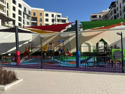 a playground in a building with a play area at Beautiful 1 bedroom in Port De La Mer in Dubai