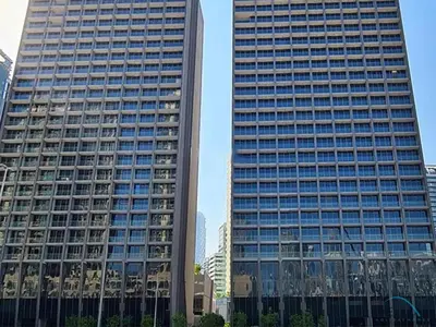 two tall buildings in a city at Plush Studio at The Sterling East House Business Bay by Deluxe Holiday Homes in Dubai