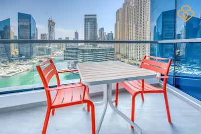 a table and two chairs on a balcony with a view at Keysplease Magnificent views of the Marina, Bay Central Dubai Marina in Dubai