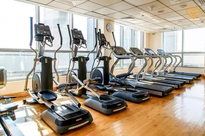 a gym with rows of cardio bikes and treadmills at Keysplease Magnificent views of the Marina, Bay Central Dubai Marina in Dubai