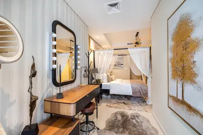 a bedroom with a mirror and a bed at Stylish 2BR at Paramount Hotel Midtown in Dubai