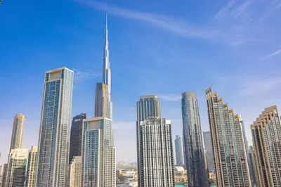 a view of a large city with a tall skyscraper at Stylish 2BR at Paramount Hotel Midtown in Dubai