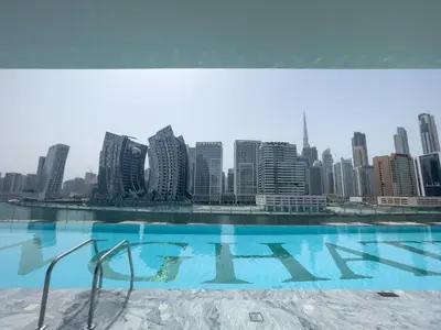 a view of the city from the roof of a building at Elegant treat with Burj Khalifa view by Suiteable in Dubai