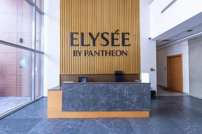 a lobby with a reception desk in a building at Modern Comfort in a Spacious Apartment - Suiteable in Dubai