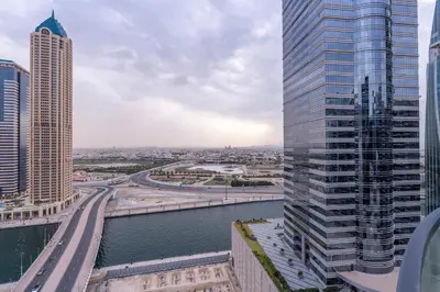a view of a city with tall buildings and a river at Serenity in Style in Zada Residence by Suiteable in Dubai