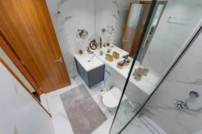 a bathroom with a sink and a toilet and a shower at Dubai Marina Apartment with Sea view, Pool and Gym in Dubai