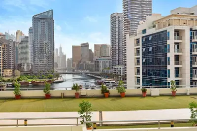 a bench on a balcony with a view of a city at Tranquil Dubai Marina Studio by JBR Beach, Marina Mall, Metro in Dubai
