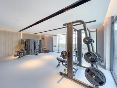 a gym with several tread machines in a room at New Listing - TOP Amenities in JVC in Dubai