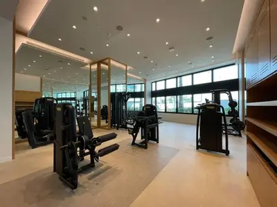 a gym with several treadmills in a building at 1BR •The Address Beach Residence - High floor in Dubai