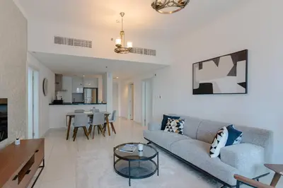 a living room with a couch and a table at Fantastic View l Great Amenities l Superb Location in Dubai