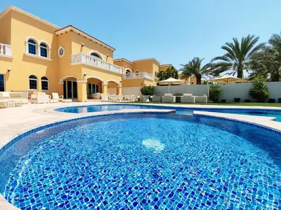 a swimming pool in front of a villa at Royal private pool, Lux 7-bedroom villa on Marina in Dubai