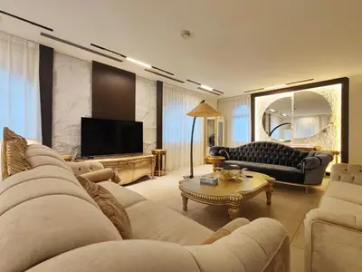 a living room with a couch and a television at Royal private pool, Lux 7-bedroom villa on Marina in Dubai