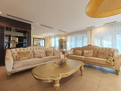 a living room with two couches and a coffee table at Royal private pool, Lux 7-bedroom villa on Marina in Dubai