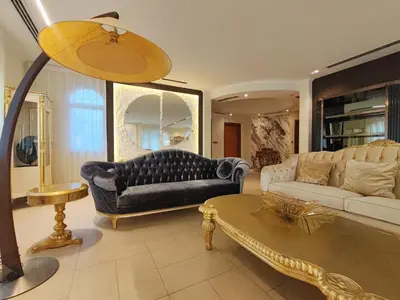 a living room with a couch and a table at Royal private pool, Lux 7-bedroom villa on Marina in Dubai