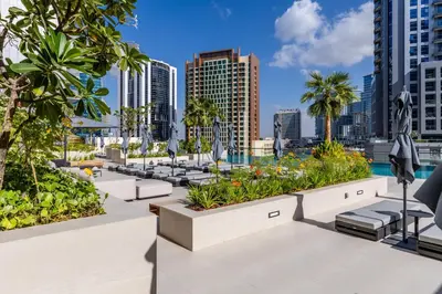 a view of the city from the rooftop of a hotel at Maison Privee - Exquisite Duplex with Private Patio & Loft Living in Dubai