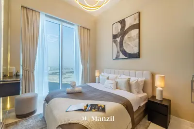 a bedroom with a large bed and a large window at Manzil - Luxury 4BR Penthouse with Harbour View & Private Terrace at Dubai Creek Harbour in Dubai
