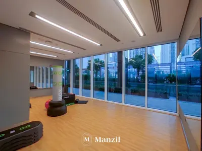 a large room with a floor to ceiling windows at Manzil - Luxury 4BR Penthouse with Harbour View & Private Terrace at Dubai Creek Harbour in Dubai