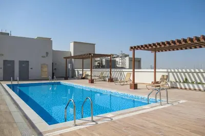 a swimming pool on the roof of a building at Frank Porter - Genesis by Meraki in Dubai