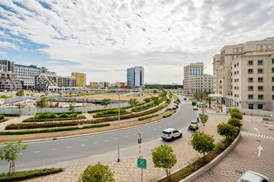 a street in a city with cars on the road at Frank Porter - Genesis by Meraki in Dubai