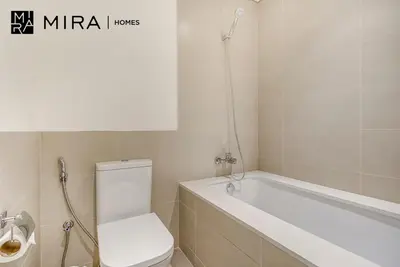 a bathroom with a toilet and a bath tub at Mira Holiday Homes - Fully furnished 2 bedroom in Dubai Hills in Dubai