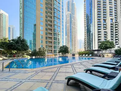 a swimming pool in a city with tall buildings at Lux BnB I The Residences I Sky Line Views in Dubai