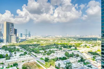 an aerial view of a city with tall buildings at Dubai Elegance: 1BR with DIFC & Zabeel Views in Dubai
