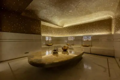 a room with a table in the middle of a room at FIVE LUXE in Dubai