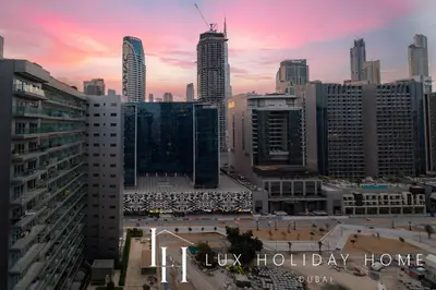 a view of a city skyline with a pink at The Majestine Studio in Dubai