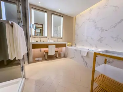 a large bathroom with a tub and a sink at The Address Residences Dubai Opera, Full Burj Khalifa View, Luxurious 2BR in Dubai