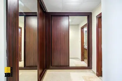 a hallway with wooden doors in a building at Lux Sea view 1BR in Dubai Marina in Dubai