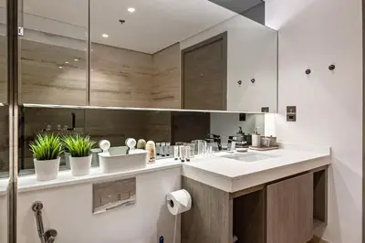 a kitchen with a sink and some potted plants at Luxury 1BR Apartment with Burj Khalifa View at Sterling in Dubai