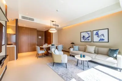 a living room with a couch and a table at Address Dubai Opera Residences in Dubai